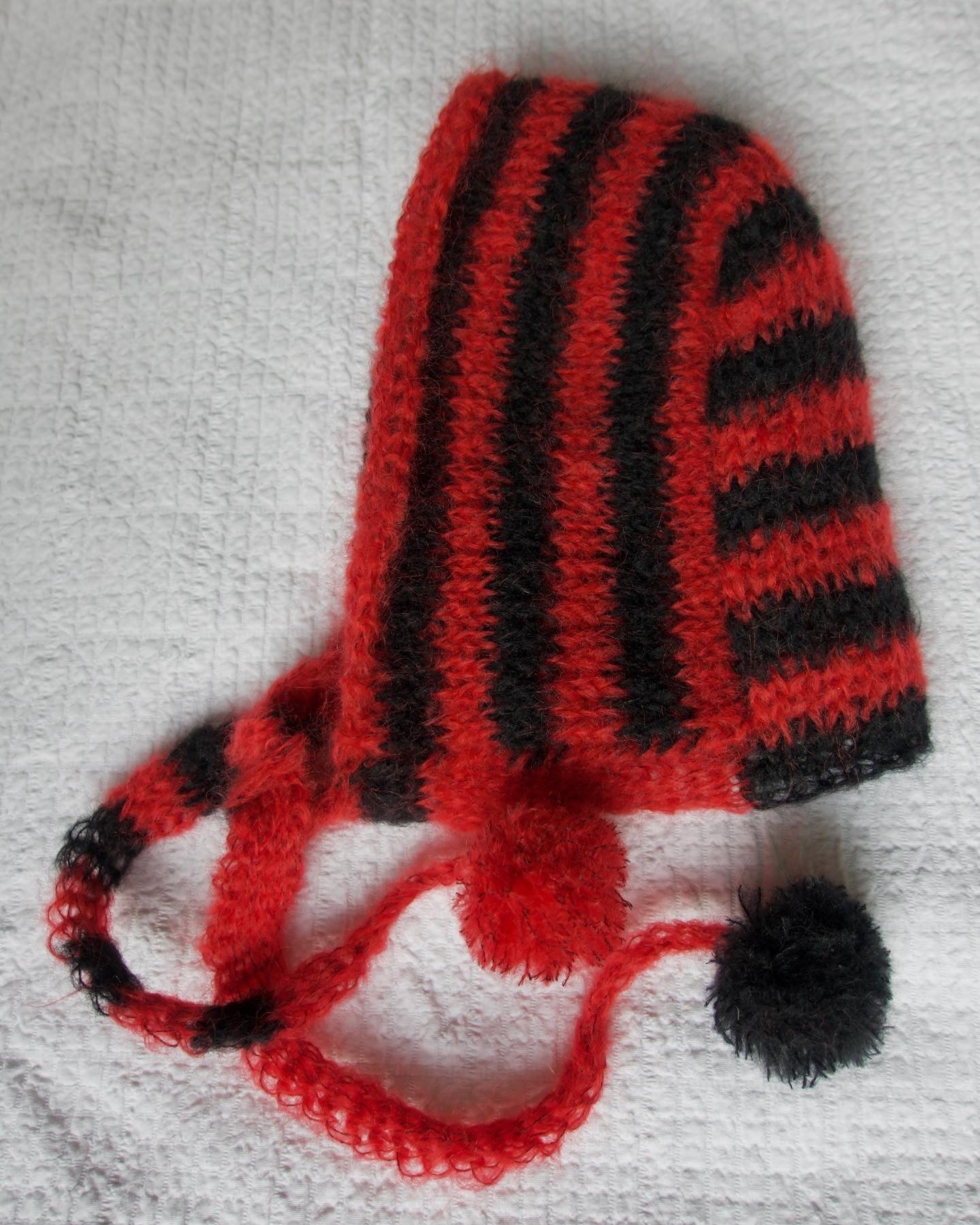 Red Black striped bonnet with the pompons