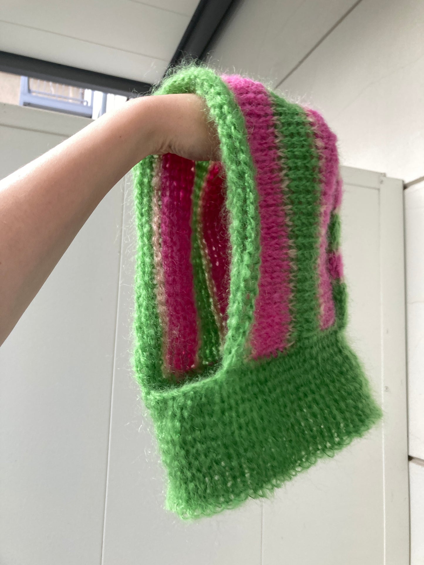 The balaclava green and pink stripes