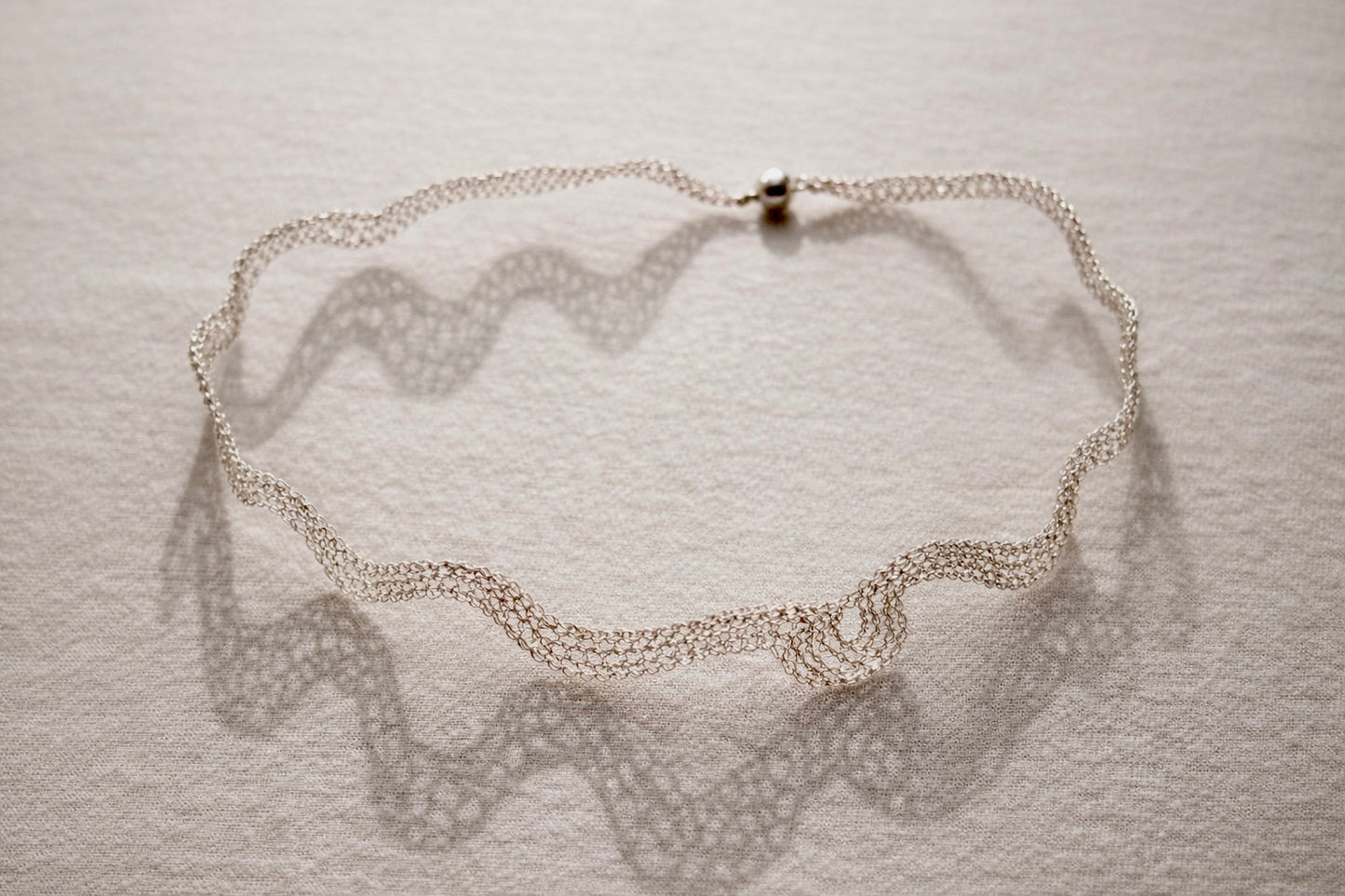 Silver choker with baroque style element