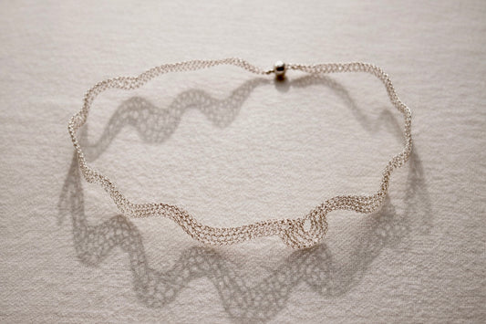 Silver choker with baroque style element
