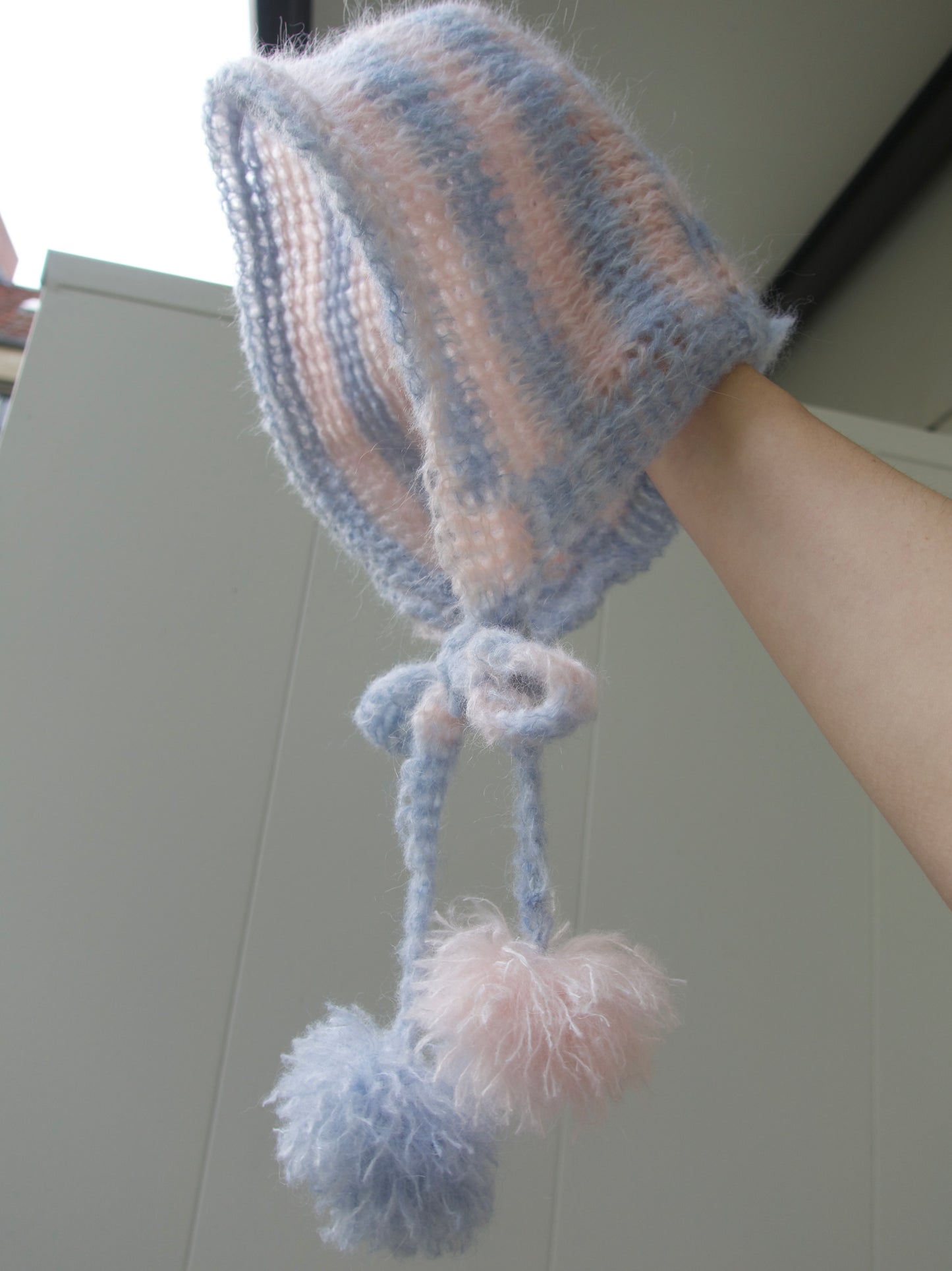 The blue-pink bonnet with pompons